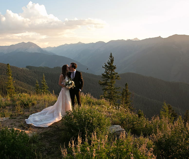 wedding couple at the top of aspen mountain