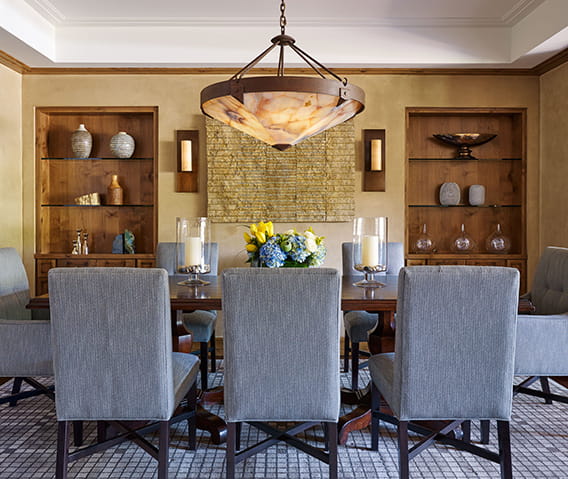 A dining room table and chairs set up in an Aspen 5 start luxury hotel.