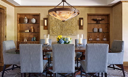 A dining room table and chairs set up in an Aspen 5 start luxury hotel.