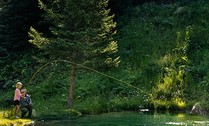 family fly fishing together