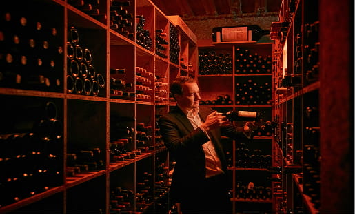 person in wine cellar