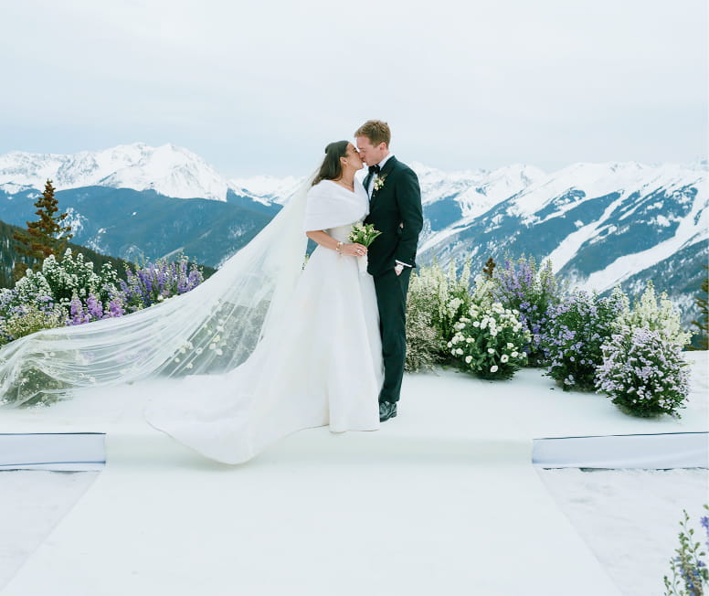 couple getting married at the top of aspen mountain in winter