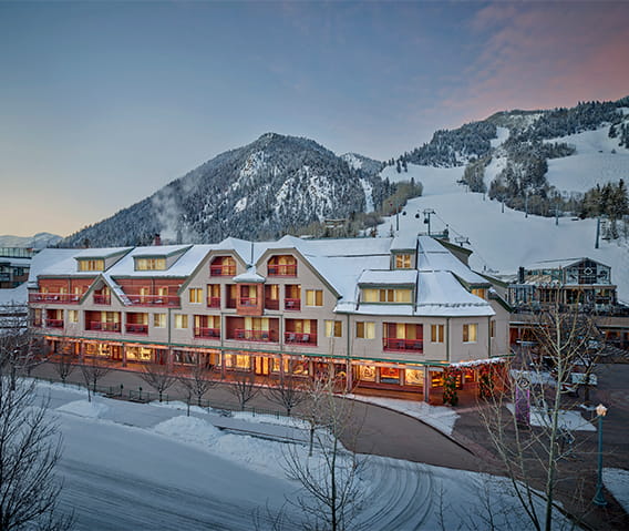 The Little Nell hotel property exterior in the winter at dusk