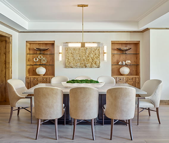 The dining room of a Residence at The Little Nell, with a large dining table set for six people.