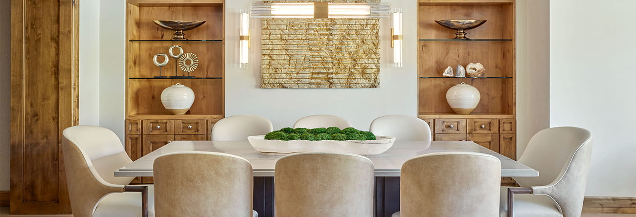 The dining room of a Residence at The Little Nell, with a large dining table set for six people.