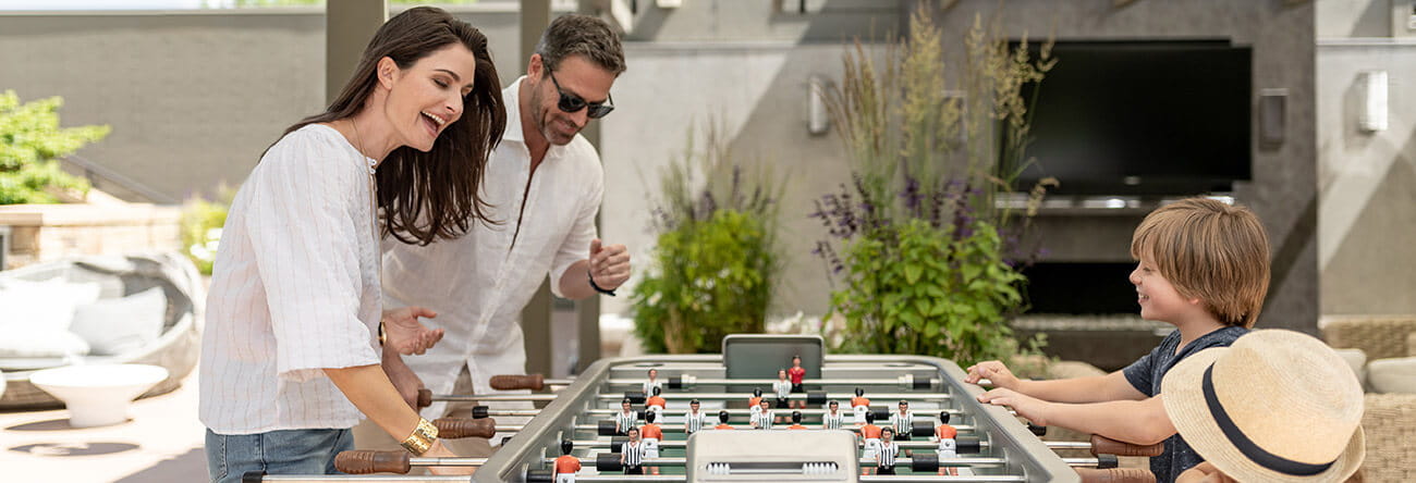 The rooftop garden deck at the Residences at The Little Nell offers activities for the whole family to enjoy, such as a foosball table.