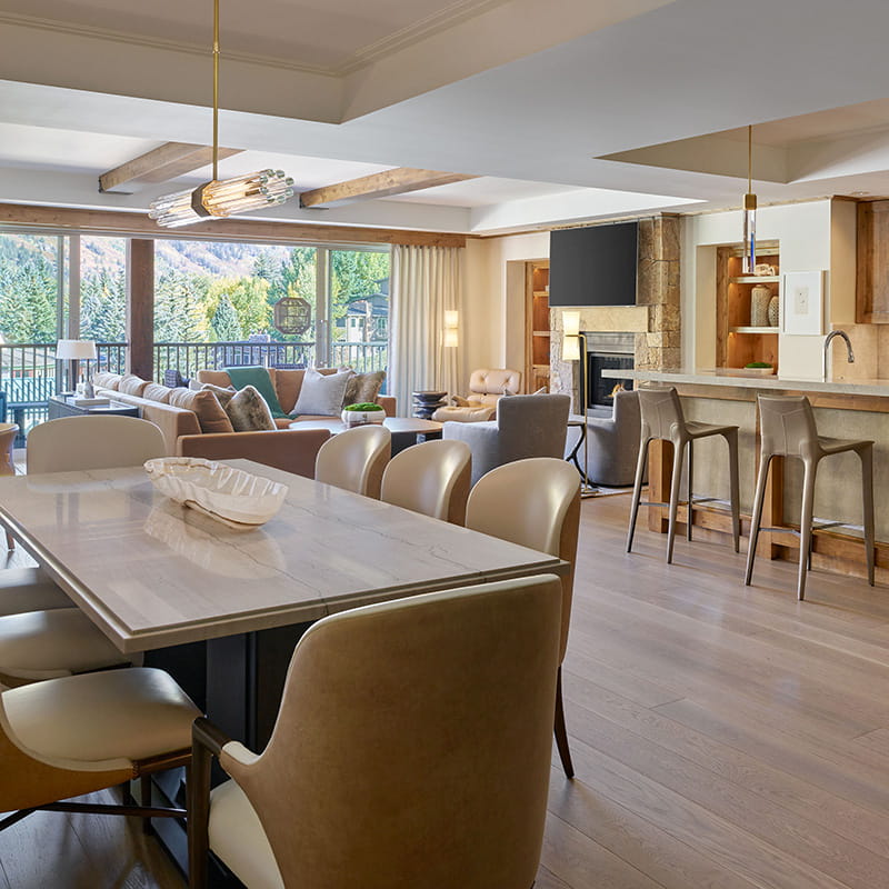 dining area, kitchen, and living room in residence