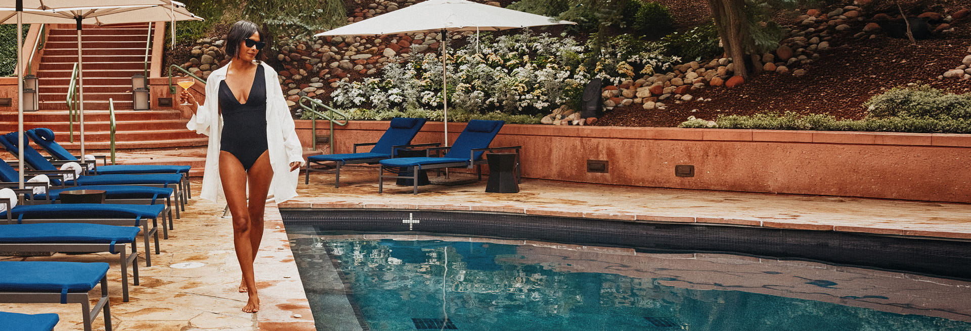 woman walking by pool