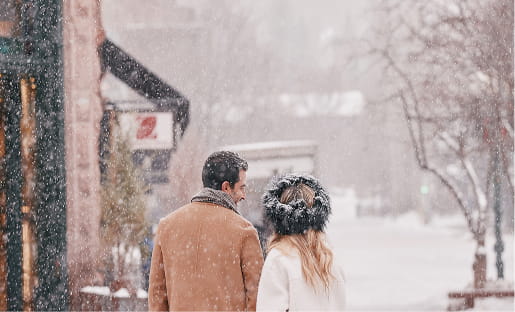couple walking in downtown aspen
