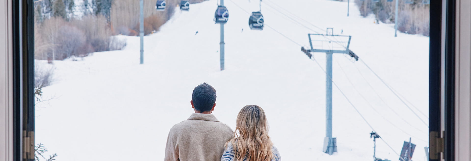 couple on hotel balcony in winter