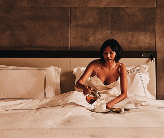 woman having breakfast in bed