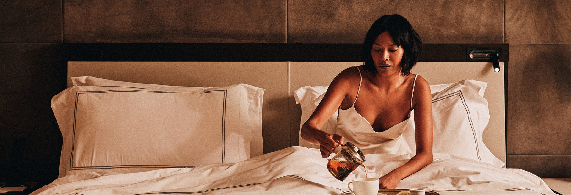 woman on bed with food