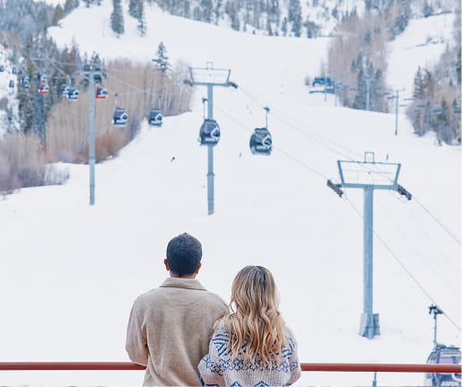 couple on hotel balcony in winter