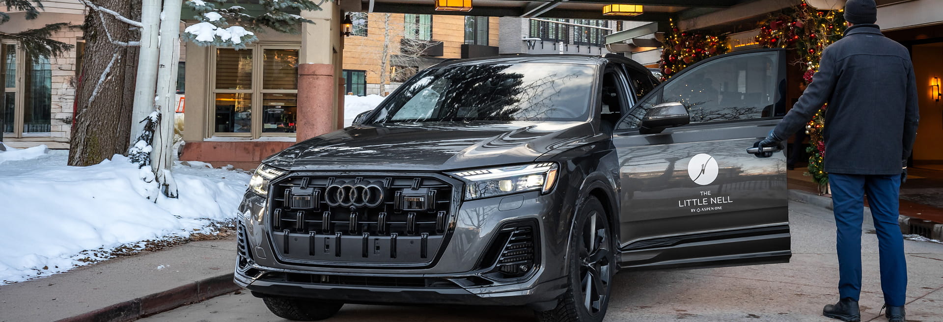 audi in front of hotel in winter