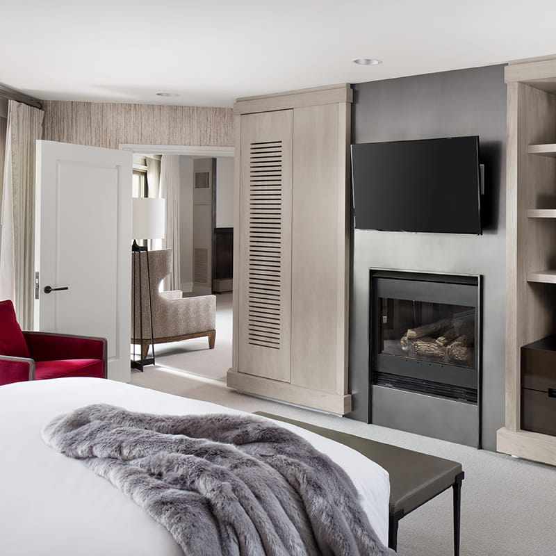king bedroom in benedict suite with tv and fireplace