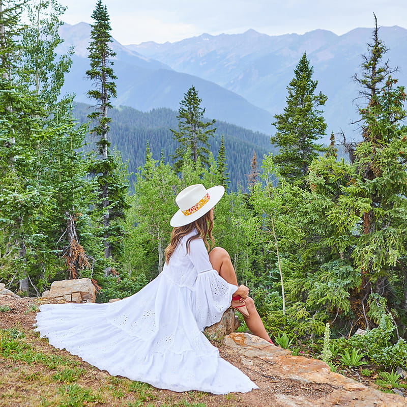 woman sitting in mountains