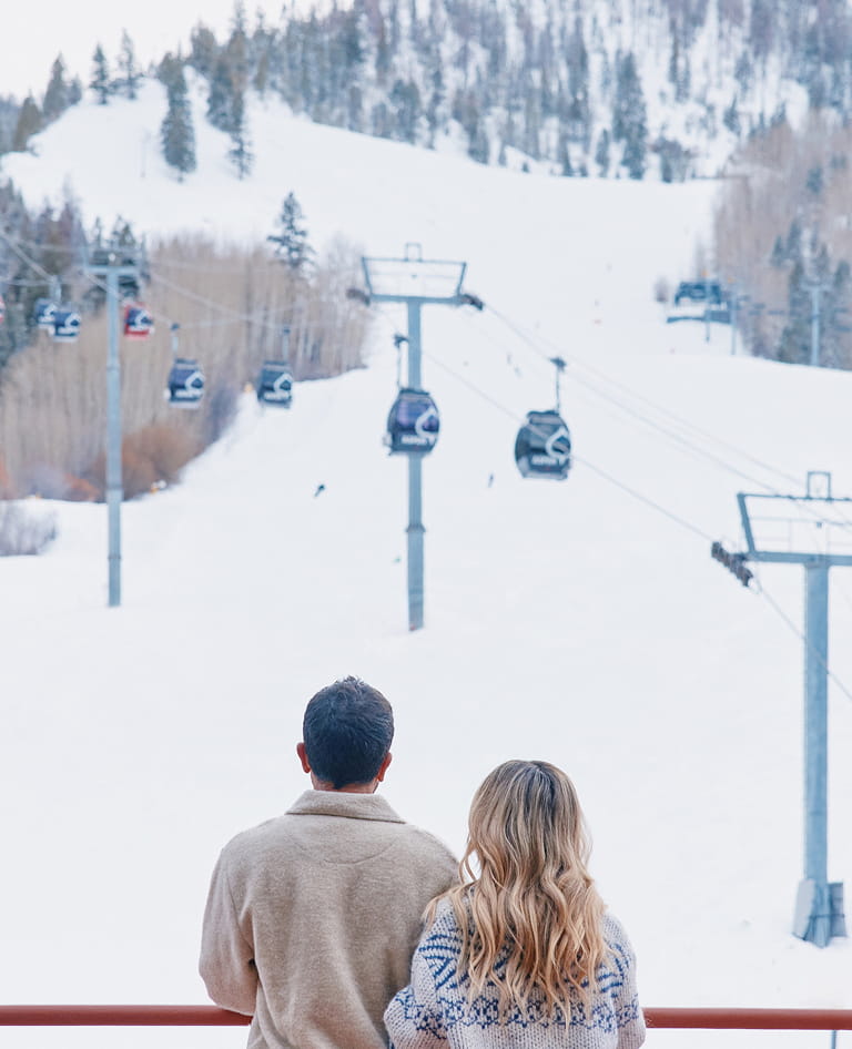 couple on balcony in winter