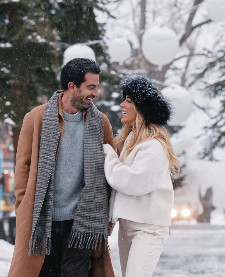 couple walking through downtown aspen