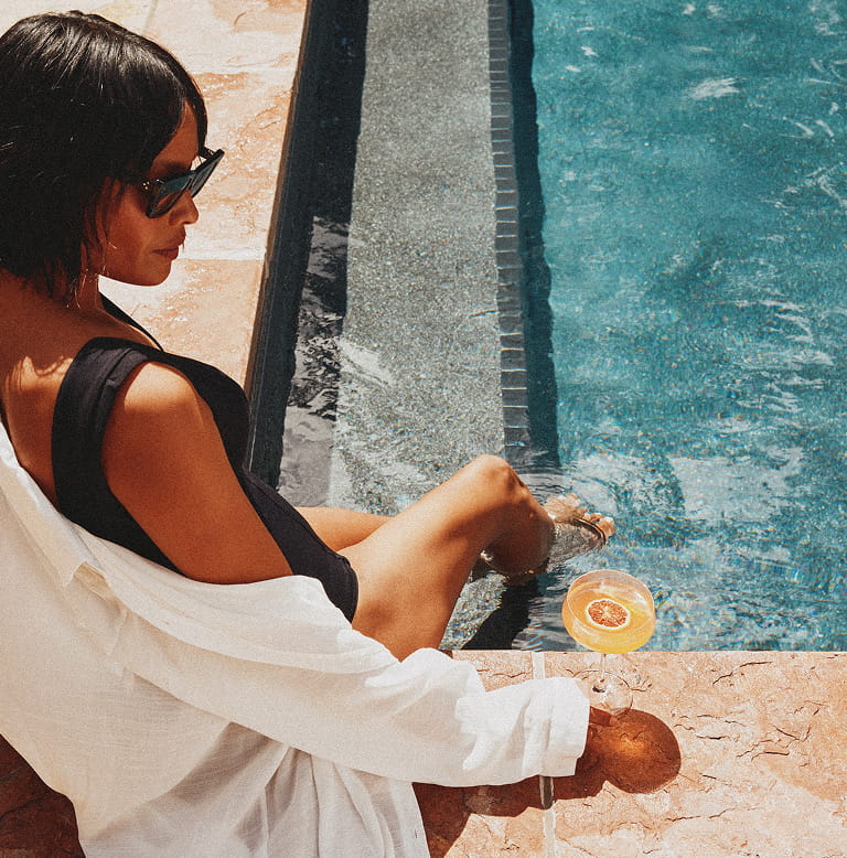 woman having drink in pool