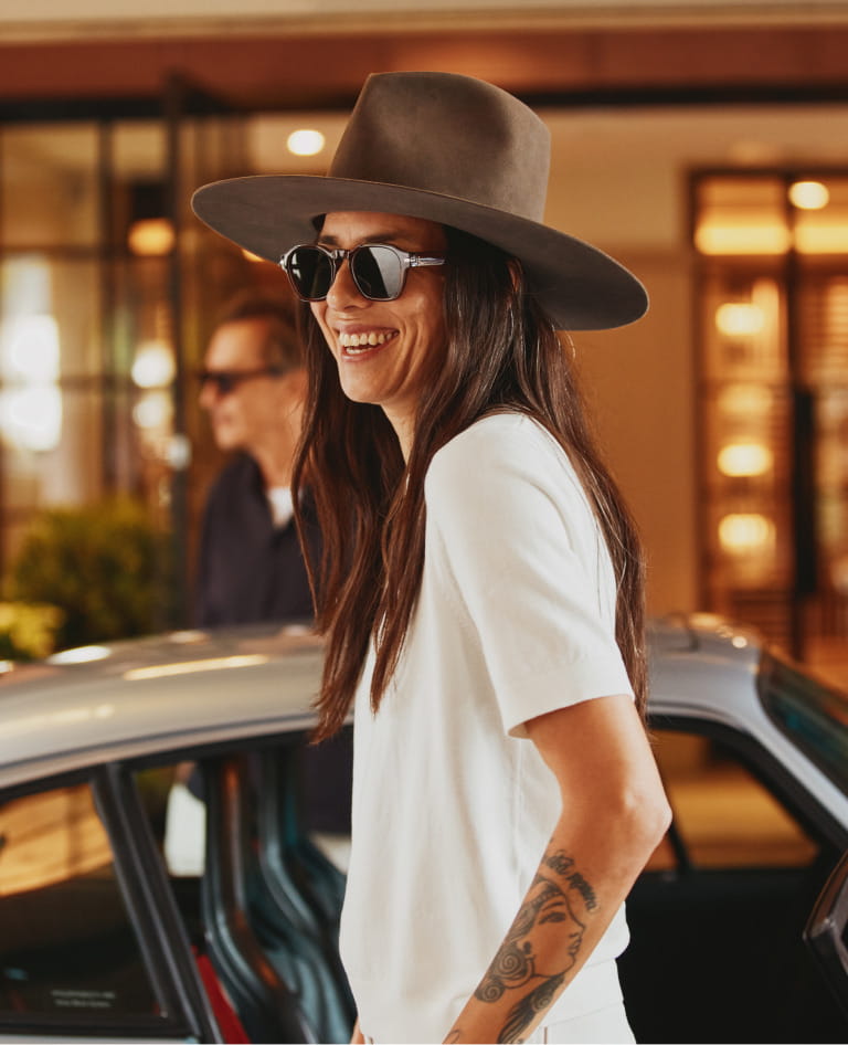 woman smiling getting out of car
