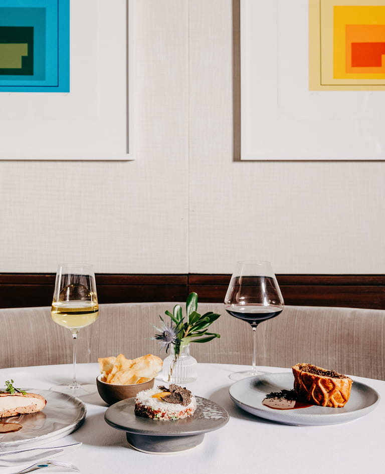food and wine on table in element 47