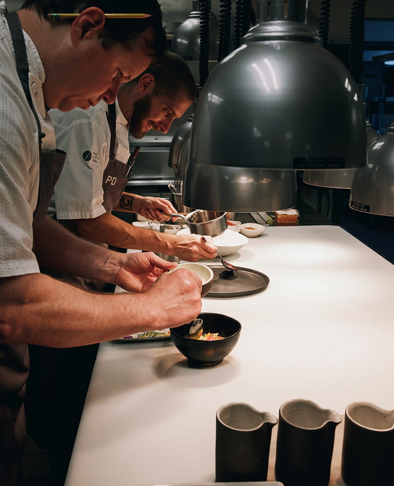 chefs plating food
