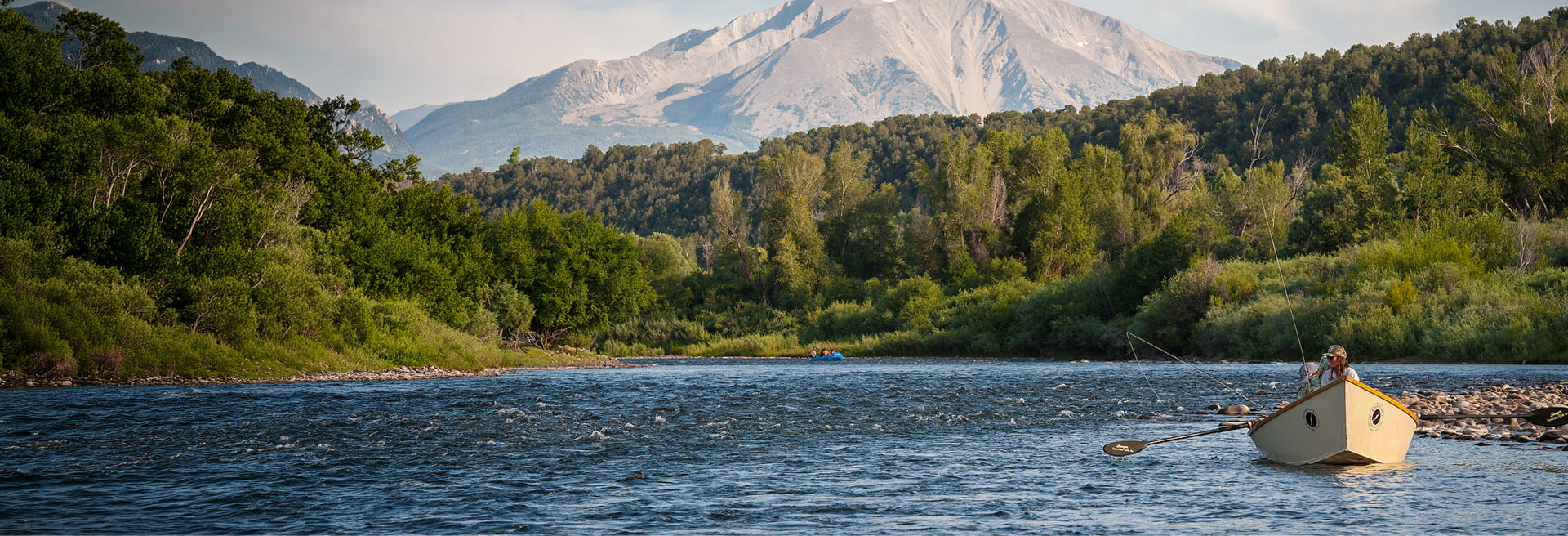 row boat going down roaring fork river