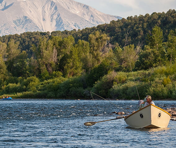 row boat going down roaring fork river
