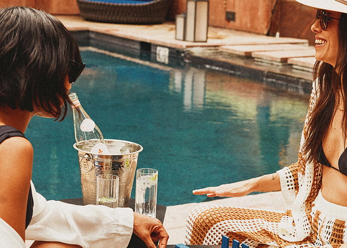 two women by pool