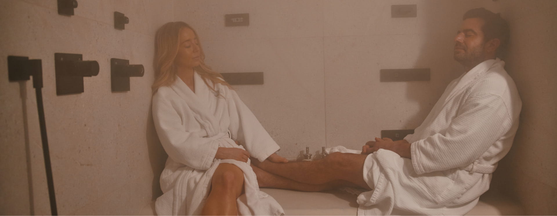 two people relaxing in steam room