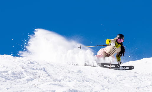 skier shredding mountain run