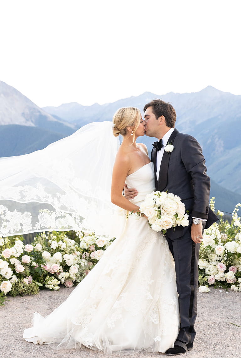 wedding couple kissing on wedding deck venue