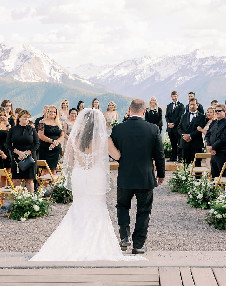 bride going down isle at wedding overlook