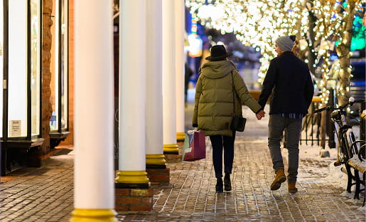 couple walking in downtown aspen at night