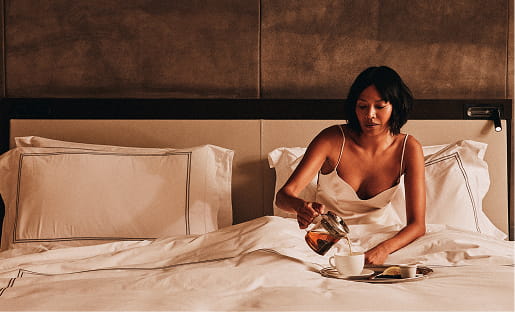 woman on bed with food