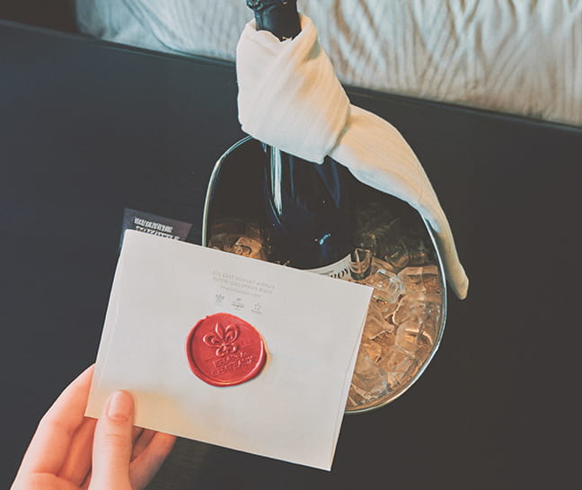 letter in front of champagne bottle